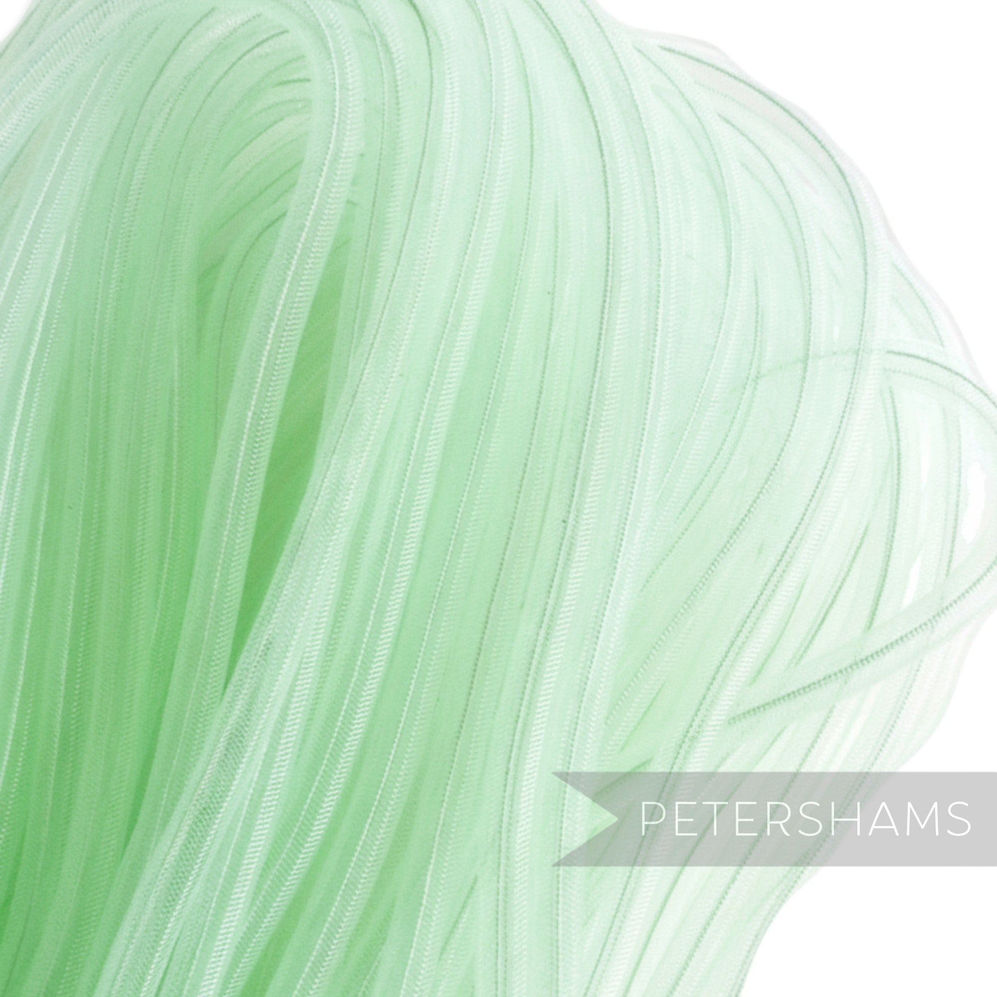 Petershams light green 8mm tube millinery crin, a sheer synthetic material with threaded sides for gathering, ideal for hat making trims.