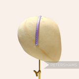 Petershams Millinery Supplies vintage 1960s skinny lilac swirl headband with glossy finish.