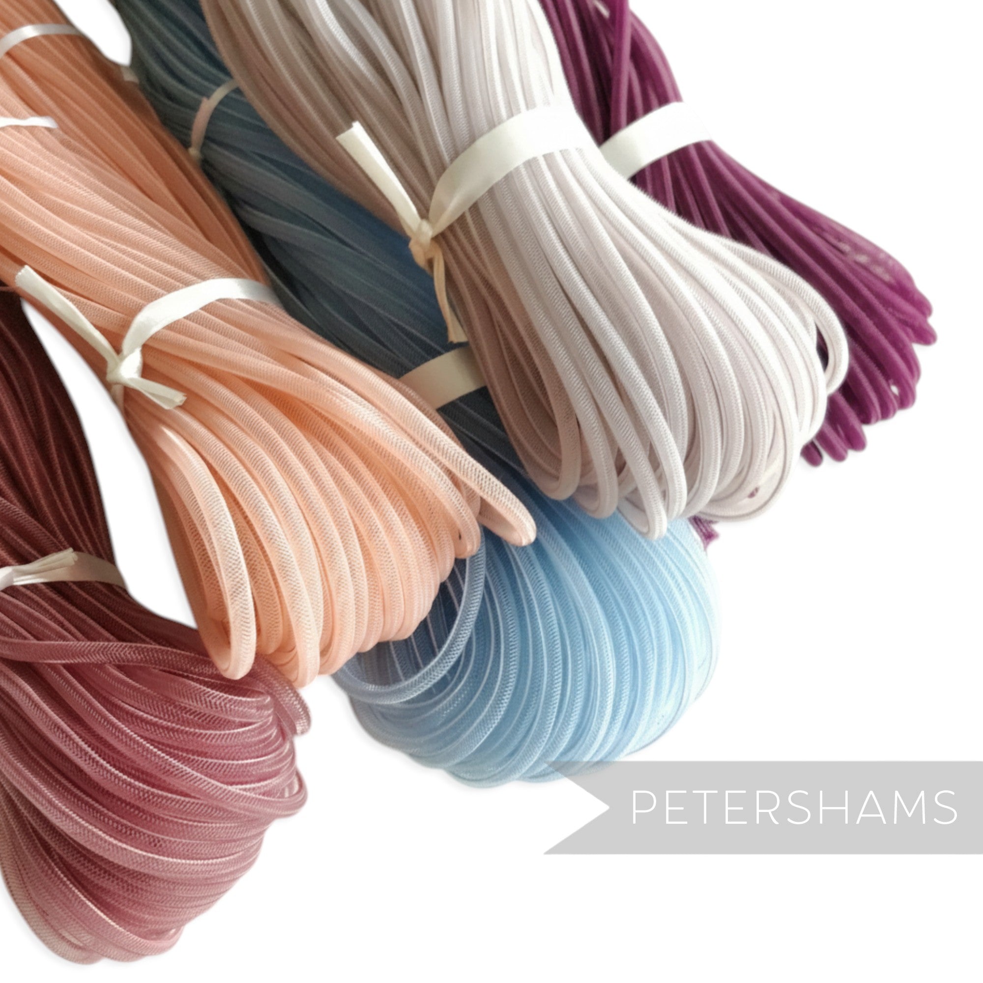 Petershams Millinery Supplies 4mm tube crin in peach, dusty rose, sky blue, pale grey, and plum. Slightly sheer, gathered trim.