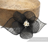 Petershams Millinery Supplies black sinamay hibiscus flower with rolled leaves and stamens, 15cm wide.