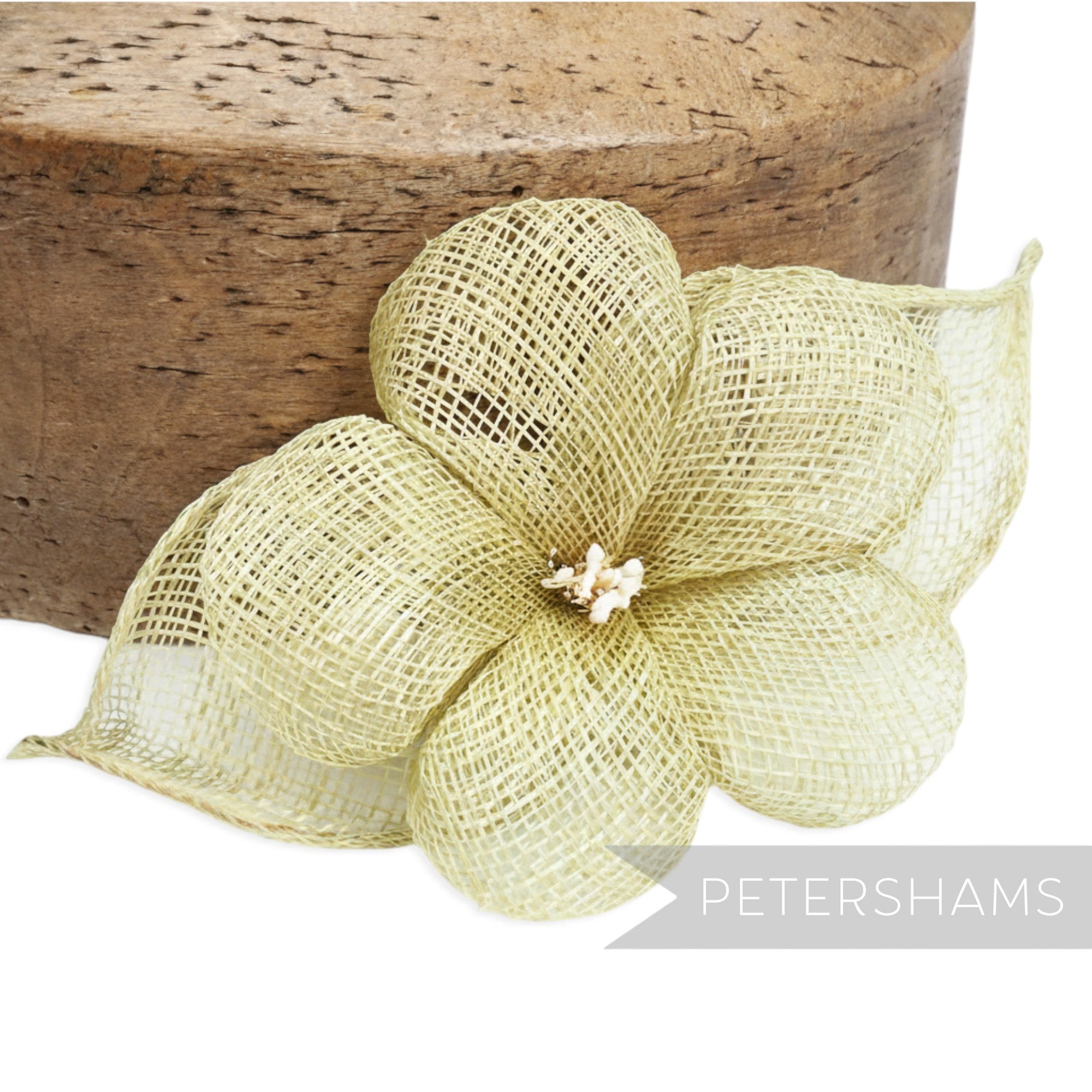 Petershams Millinery Supplies 'Sophie' hibiscus style sinamay flower mount in pale gold with sinamay leaves and stamens.