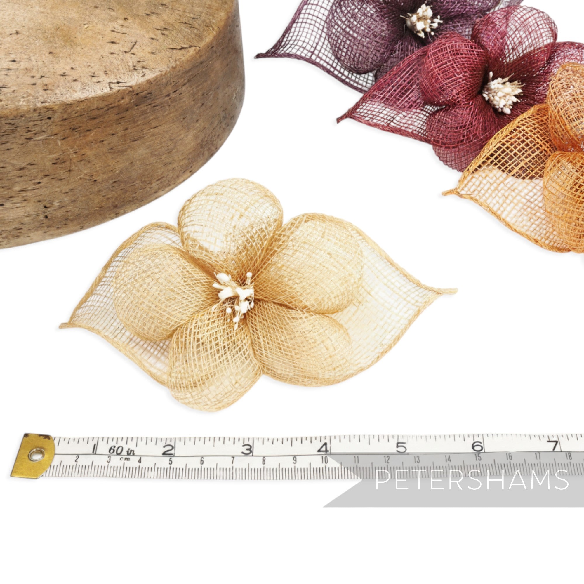 Petershams Millinery Supplies 'Sophie' hibiscus sinamay flower mount in gold with leaves and stamens. 15cm wide.