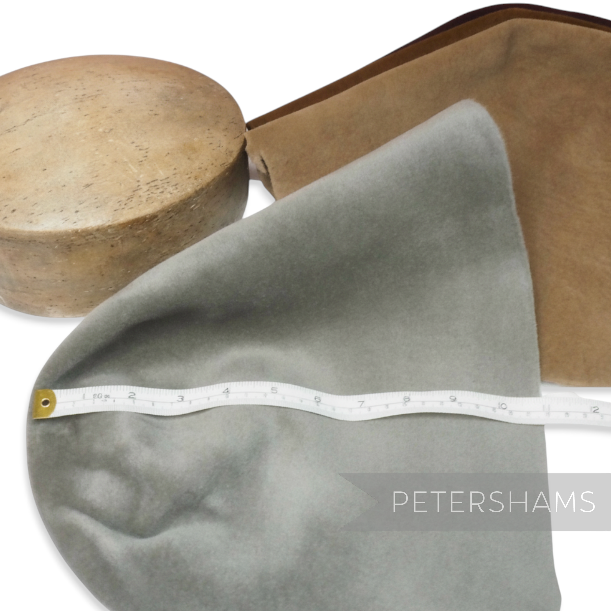 Petershams Millinery Supplies light grey velour fur felt cone hat body with a measuring tape.
