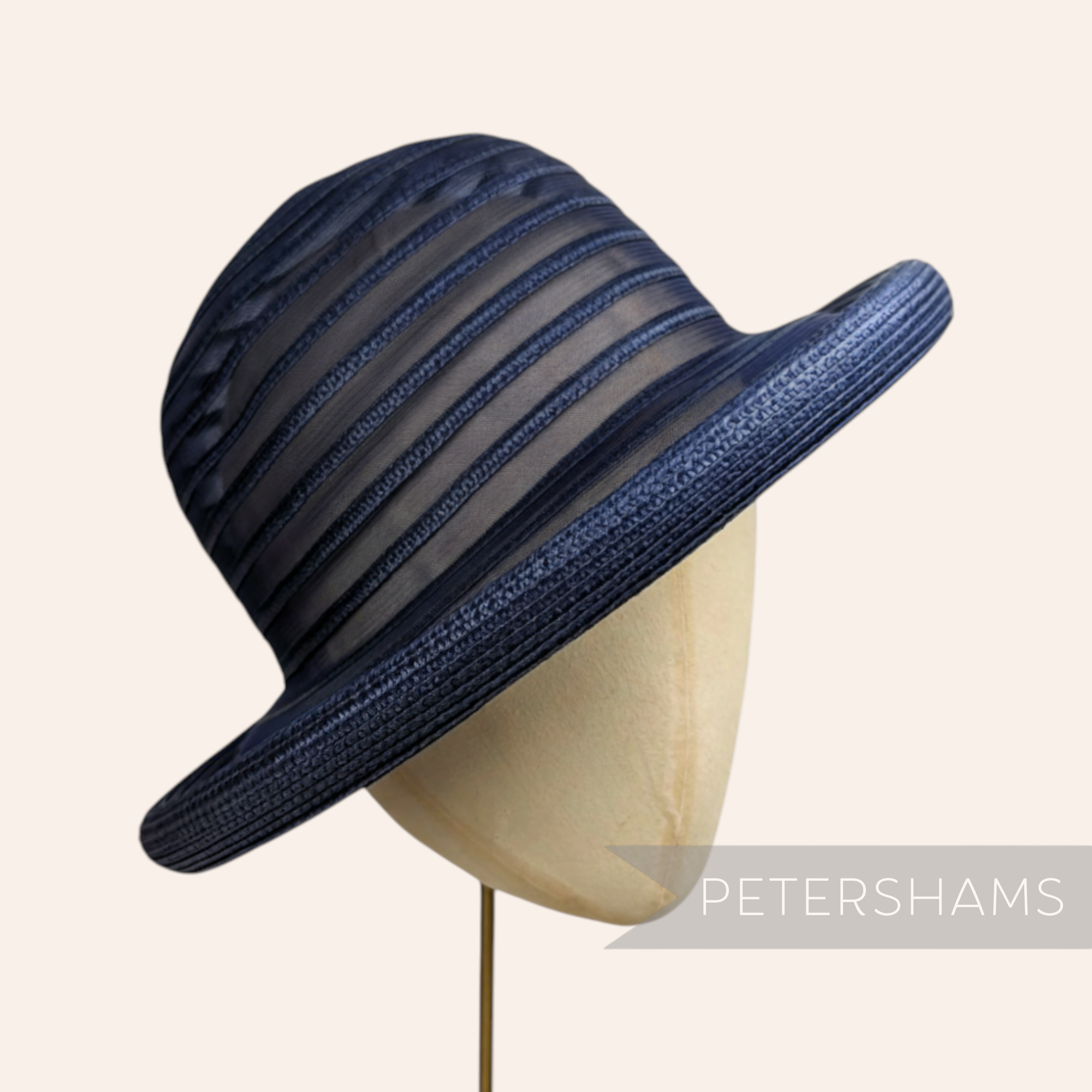 Petershams Millinery Supplies navy blue crinoline and poly-braid hat base with rolled edge brim and striped sheer crown.