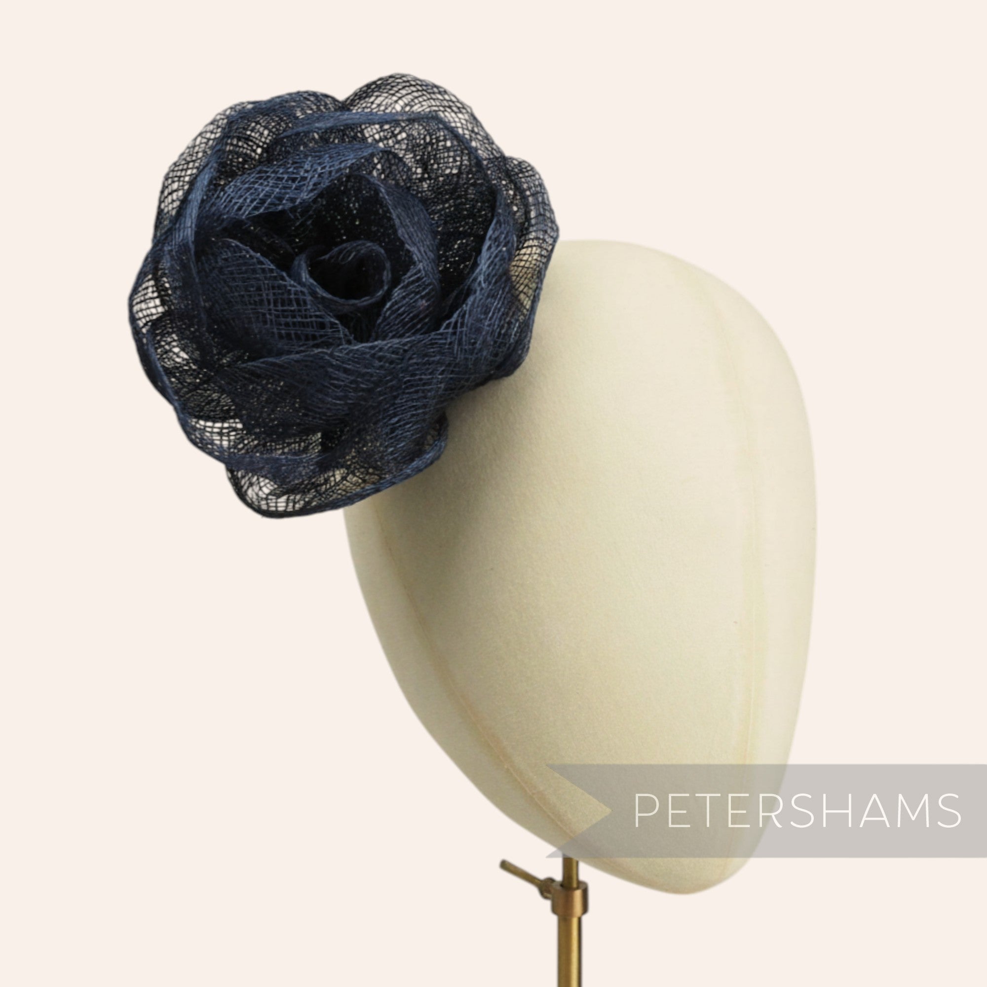 Petershams Millinery Supplies navy blue sinamay cabbage rose flower mount with wired leaf, 10cm width.