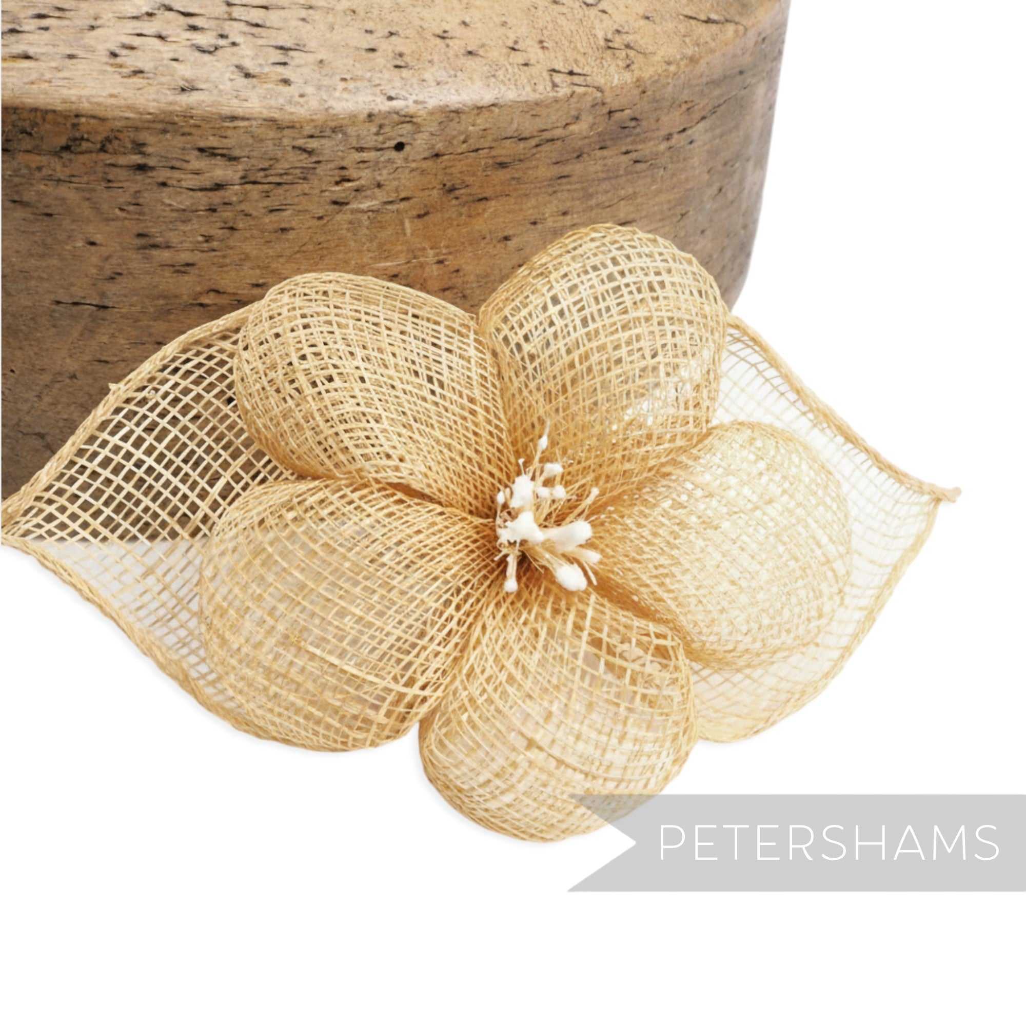 Petershams Millinery Supplies natural sinamay hibiscus flower with rolled leaves and stamens. 15cm wide.