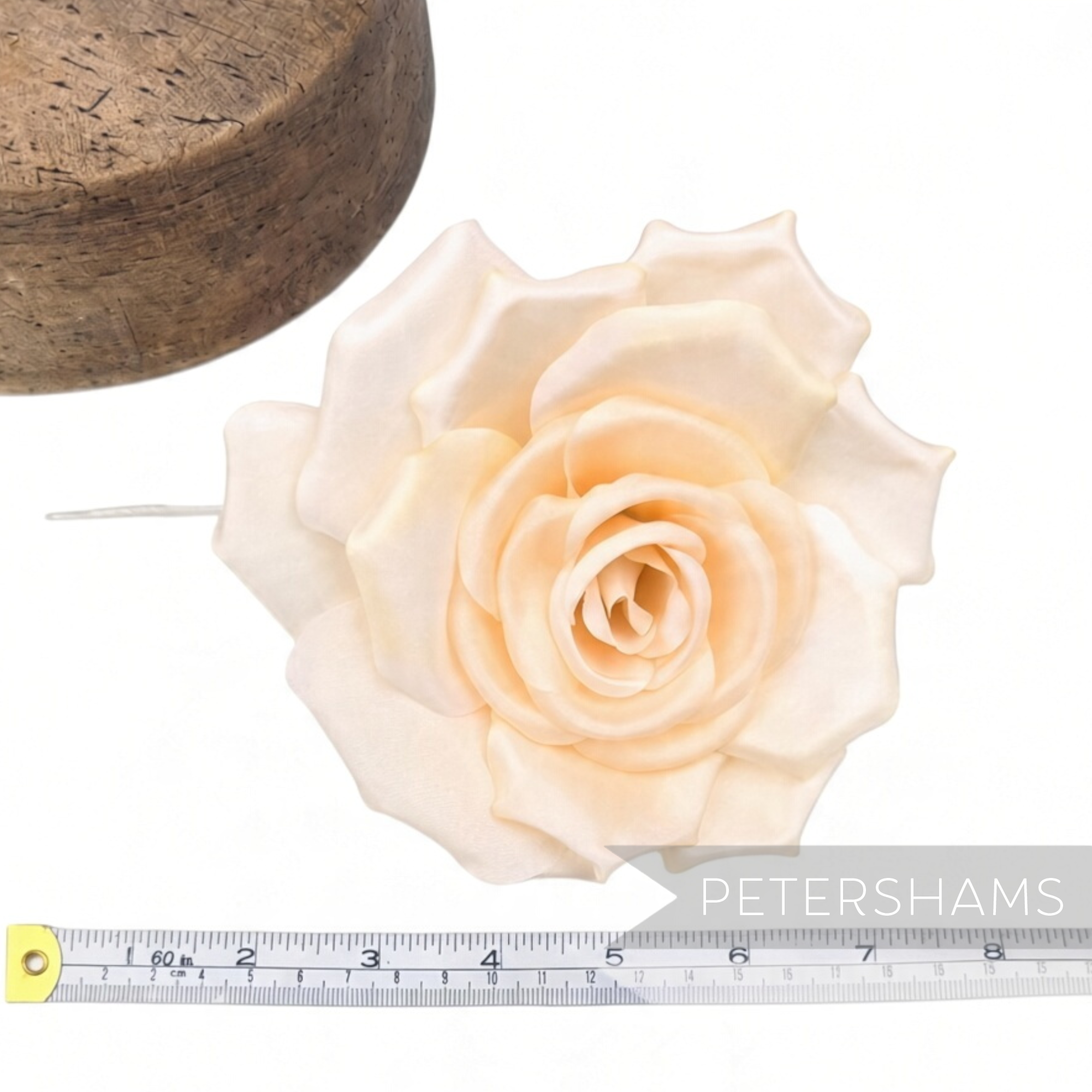 Petershams Millinery Supplies Mandy asymmetric cream fabric flower hat mount with wired stem for millinery projects.
