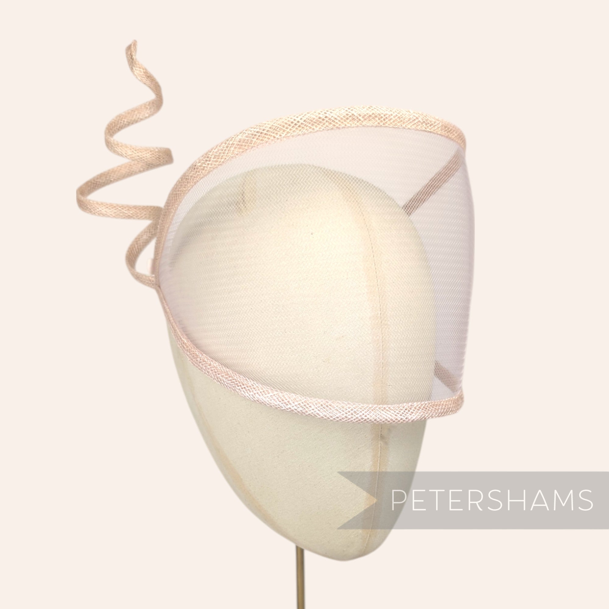 Petershams Millinery Supplies light beige crin and sinamay visor fascinator with a decorative wired spiral trim.