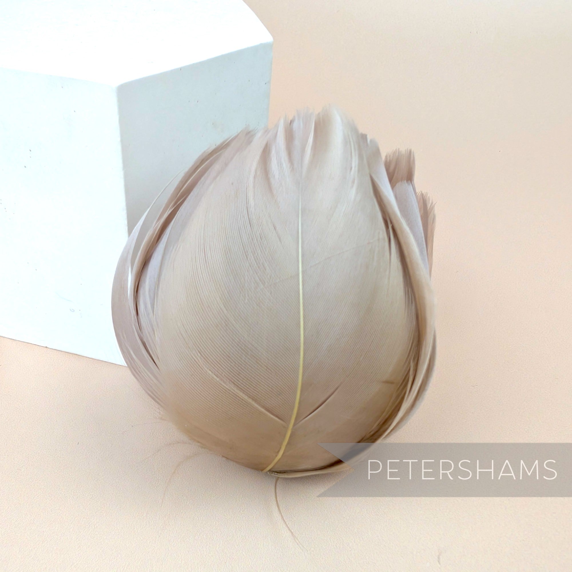 Petershams Millinery Supplies large tulip shaped flower made from beige cupped goose nagorie feathers