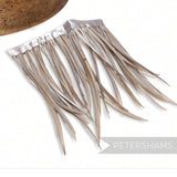 Petershams Millinery Supplies goose biot feather fringe in a neutral beige tone with a satin ribbon binding.