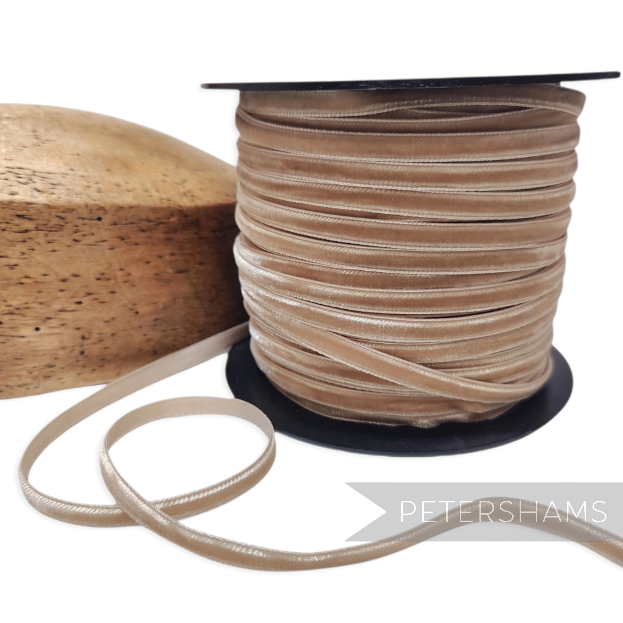 Petershams Millinery Supplies 7mm warm sand French velvet ribbon on a spool with a wooden millinery block