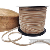 Petershams Millinery Supplies 7mm warm sand French velvet ribbon on a spool with a wooden millinery block