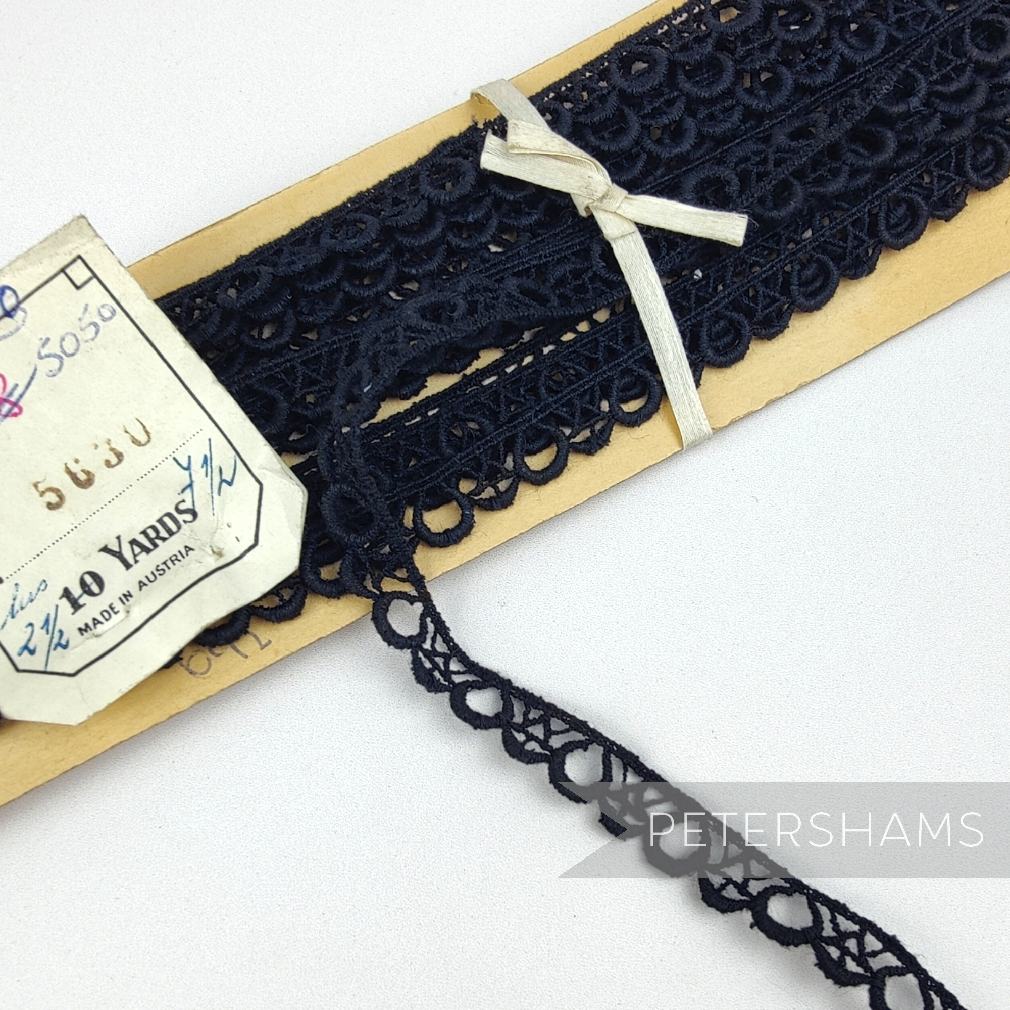 Petershams Millinery Supplies vintage 9mm black Austrian lace trim with teardrop and diamond thatch pattern on card.