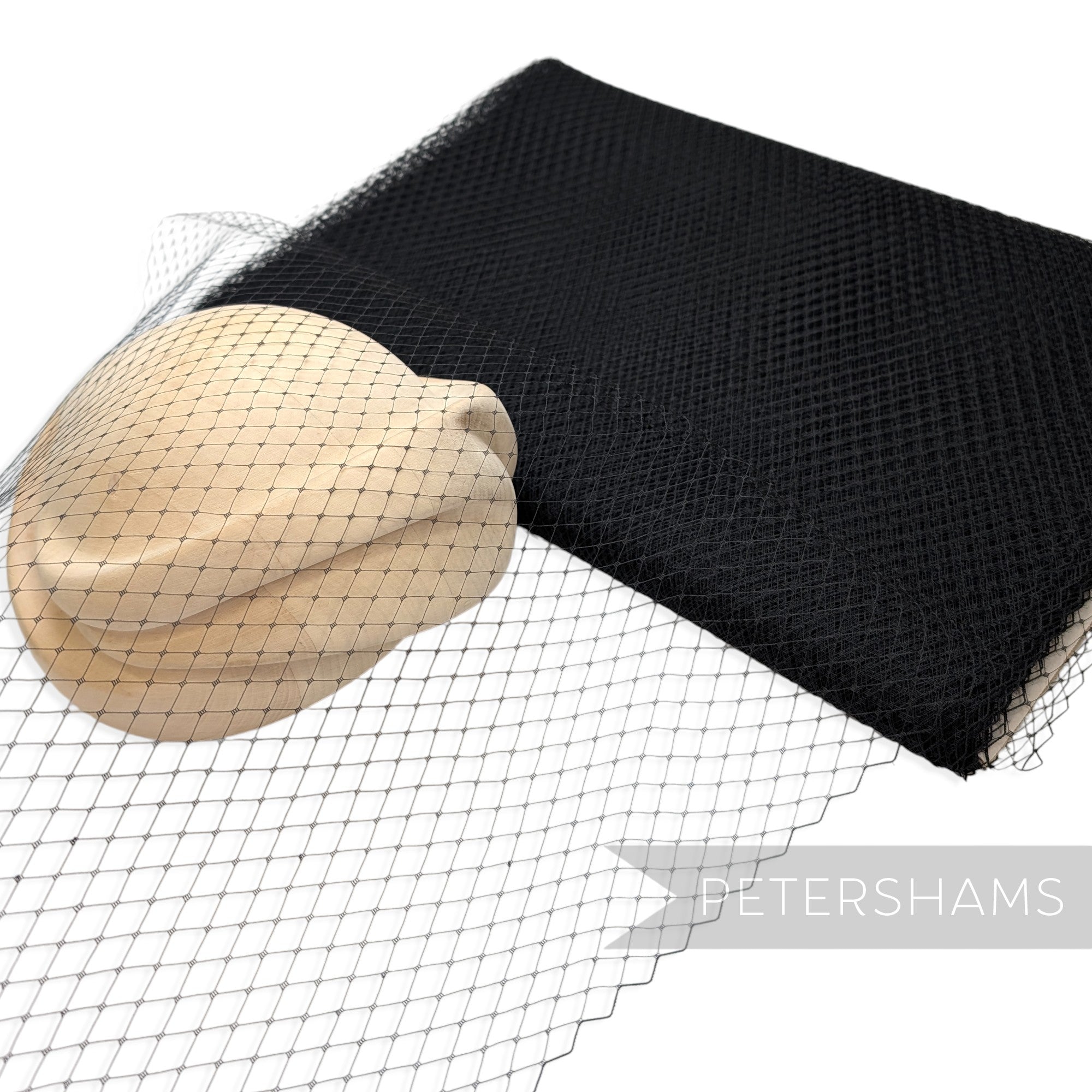 Petershams Millinery Supplies 18 inch wide black diamond pattern birdcage veiling draped over a wooden hat block