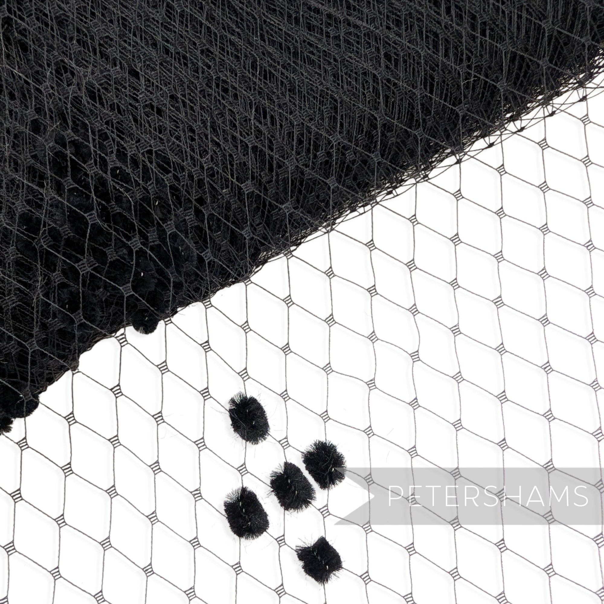 Petershams Millinery Supplies black vintage replica veiling with an intricate chenille dotted diamond pattern.