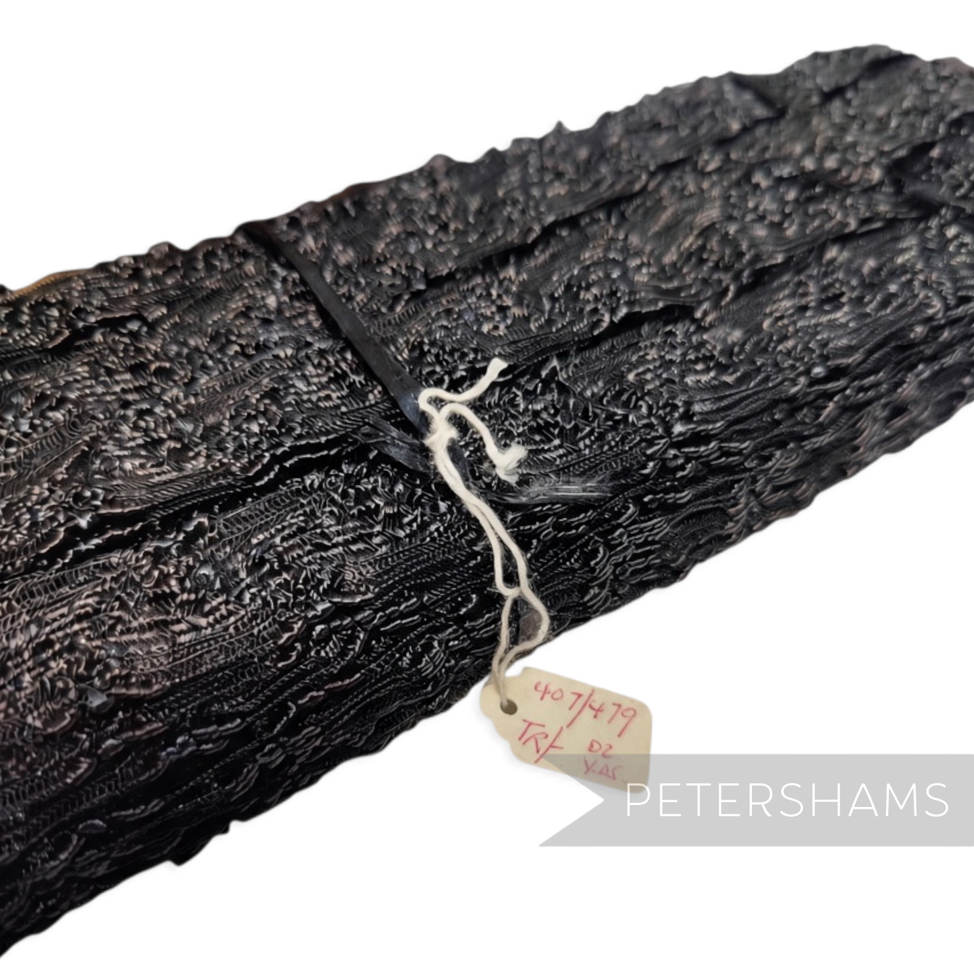 Petershams Millinery Supplies 23mm black vintage crinoline braid with a zig zag frill texture and shiny finish.