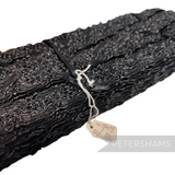 Petershams Millinery Supplies 23mm black vintage crinoline braid with a zig zag frill texture and shiny finish.