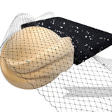 Petershams Millinery Supplies black veiling with clear acrylic diamantes draped over a wooden millinery block