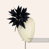 Petershams Millinery Supplies Kay large black goose feather pom flower hat mount on a millinery display head