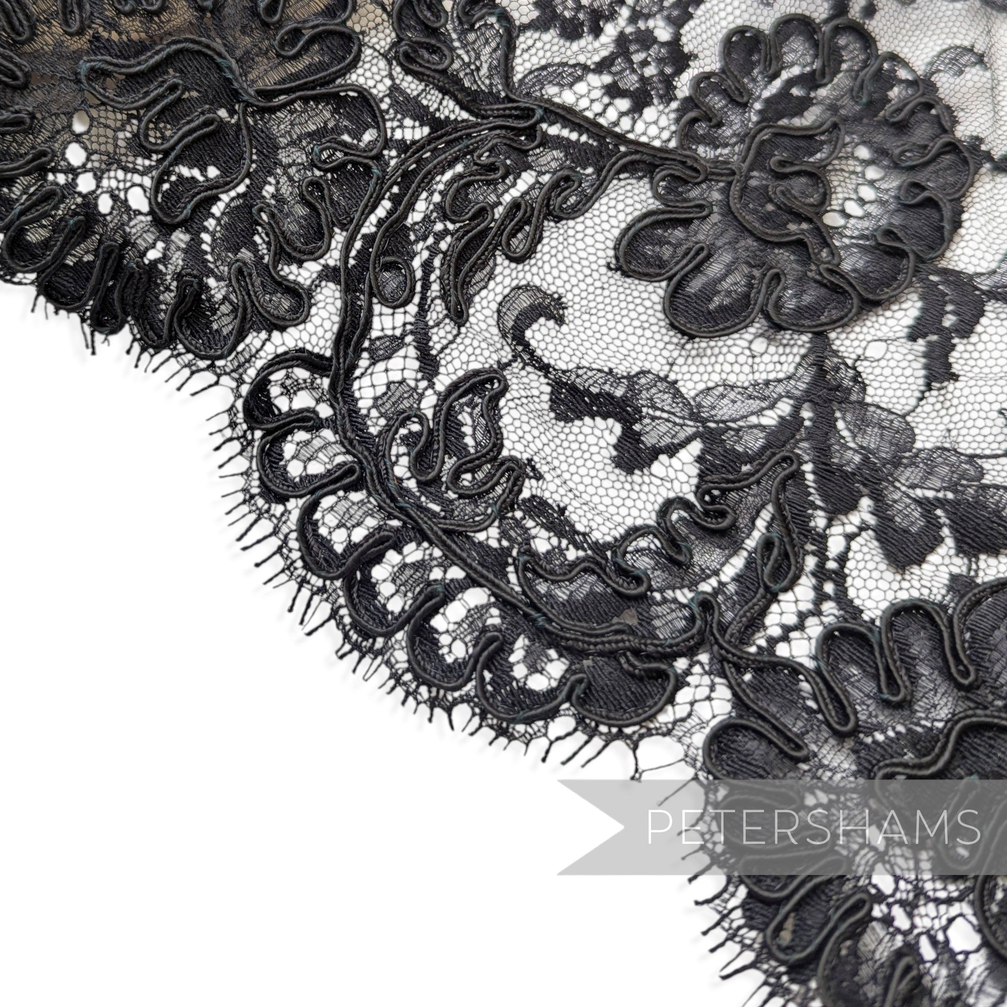 Petershams Millinery Supplies vintage 1980s black floral lace trim with intricate silky cords and double scallop edge
