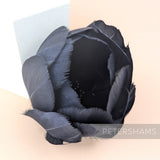 Petershams Millinery Supplies large black tulip flower made from cupped goose nagorie feathers with central stamens.