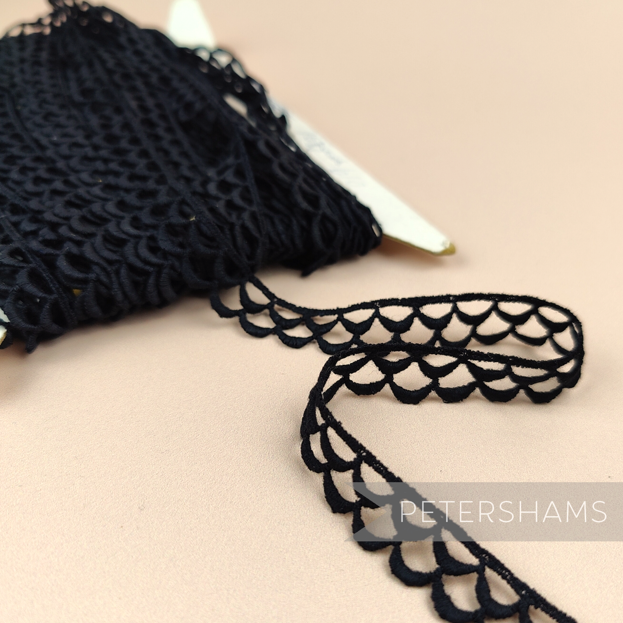 Petershams Millinery Supplies vintage 13mm black guipure lace trim with a delicate eyelash wheel design on a spool