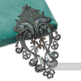 Petershams Millinery Supplies heart-shaped black lace motif with iridescent sequins and faux pearl accents.