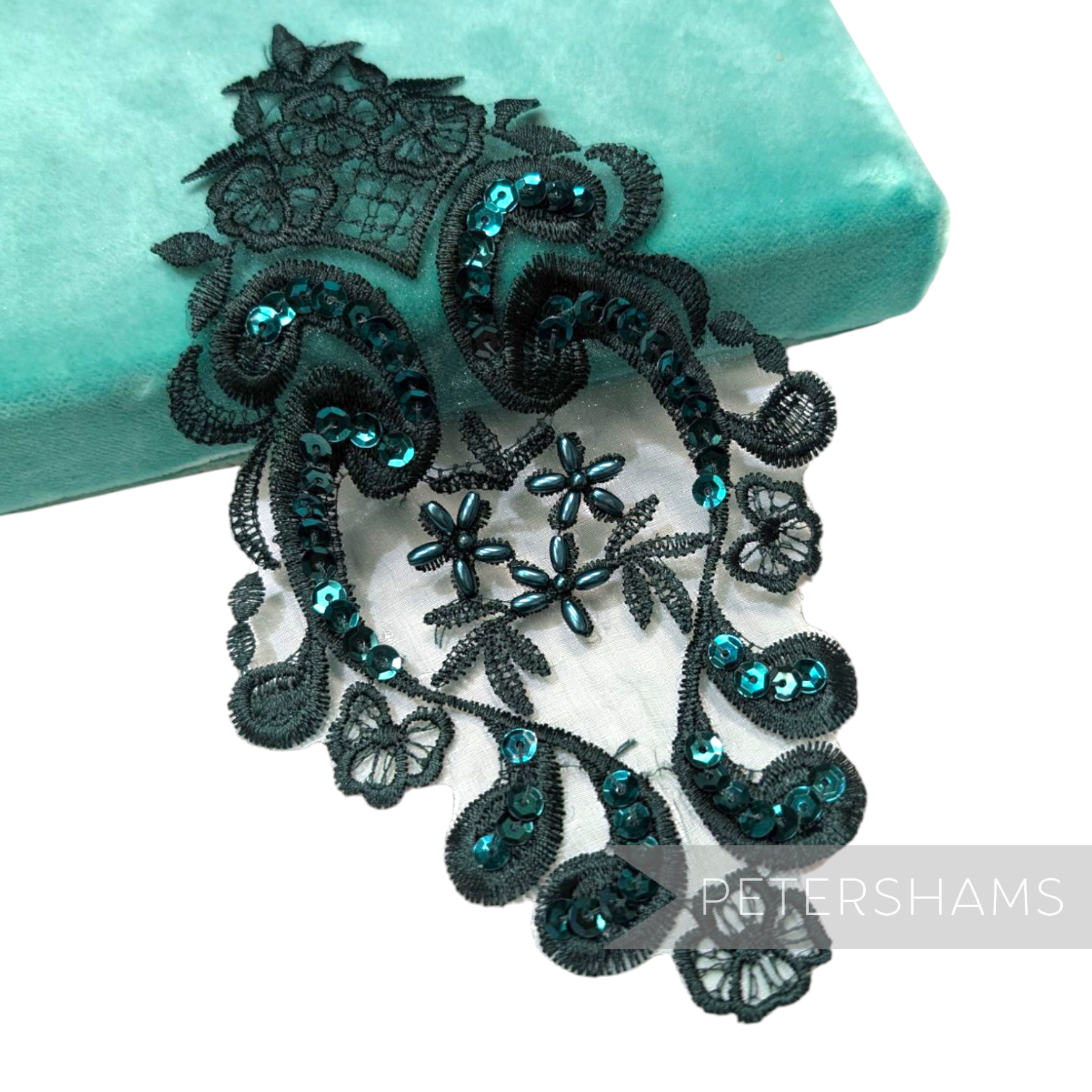 Petershams Millinery Supplies black lace motif with iridescent teal sequins and faux pearls for bridal headpieces.