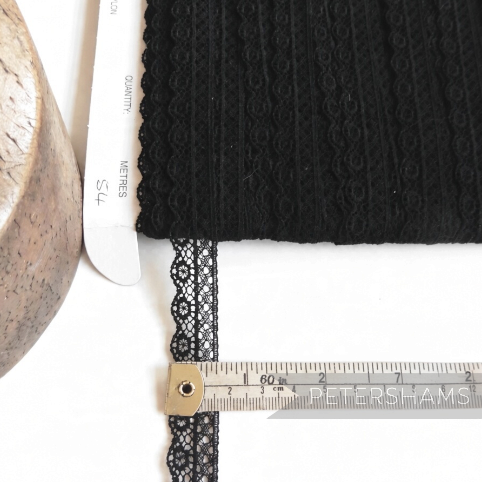 Petershams Millinery Supplies 15mm black cotton lace trim with a delicate lattice design and scalloped edge on a card