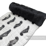Petershams Millinery Supplies black sinamay fabric featuring soft rounded leaf applique trim for hat making