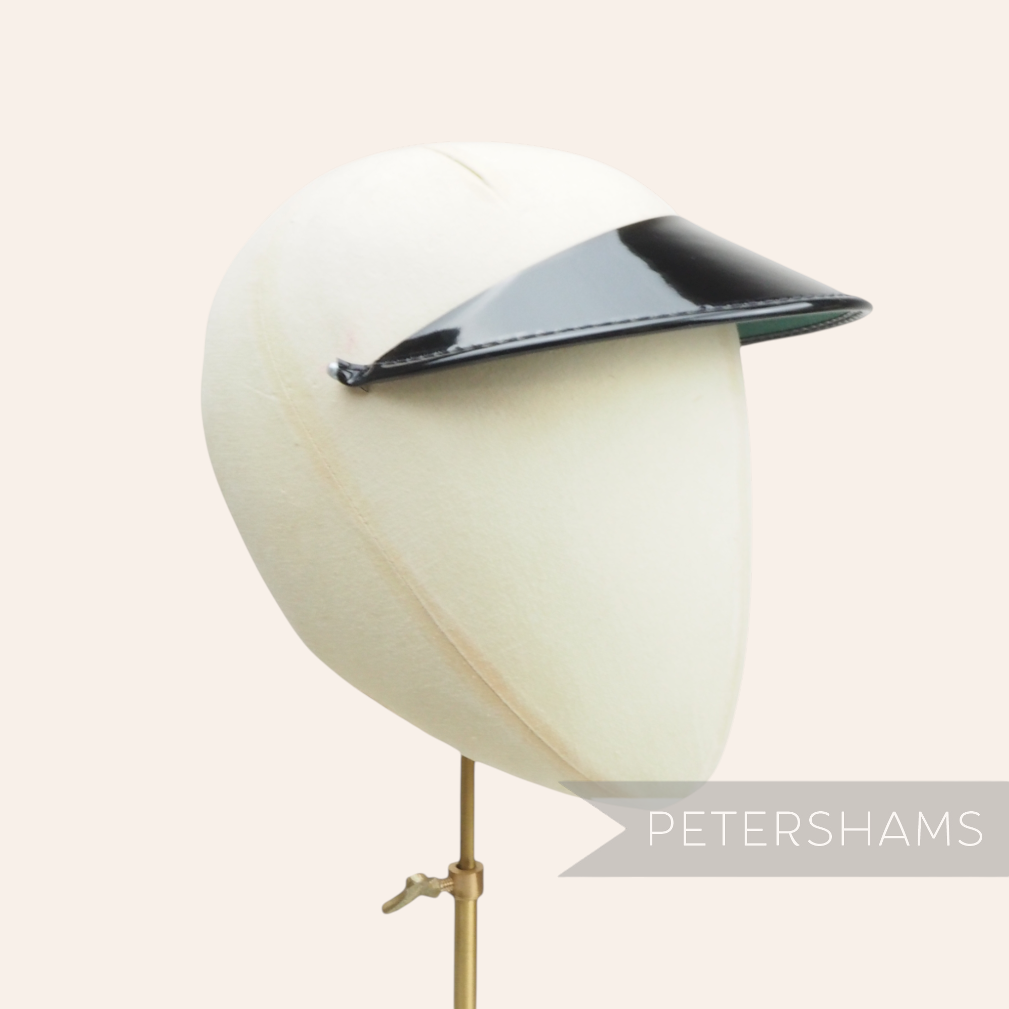 Petershams Millinery Supplies black patent leather cap peak with glossy finish
