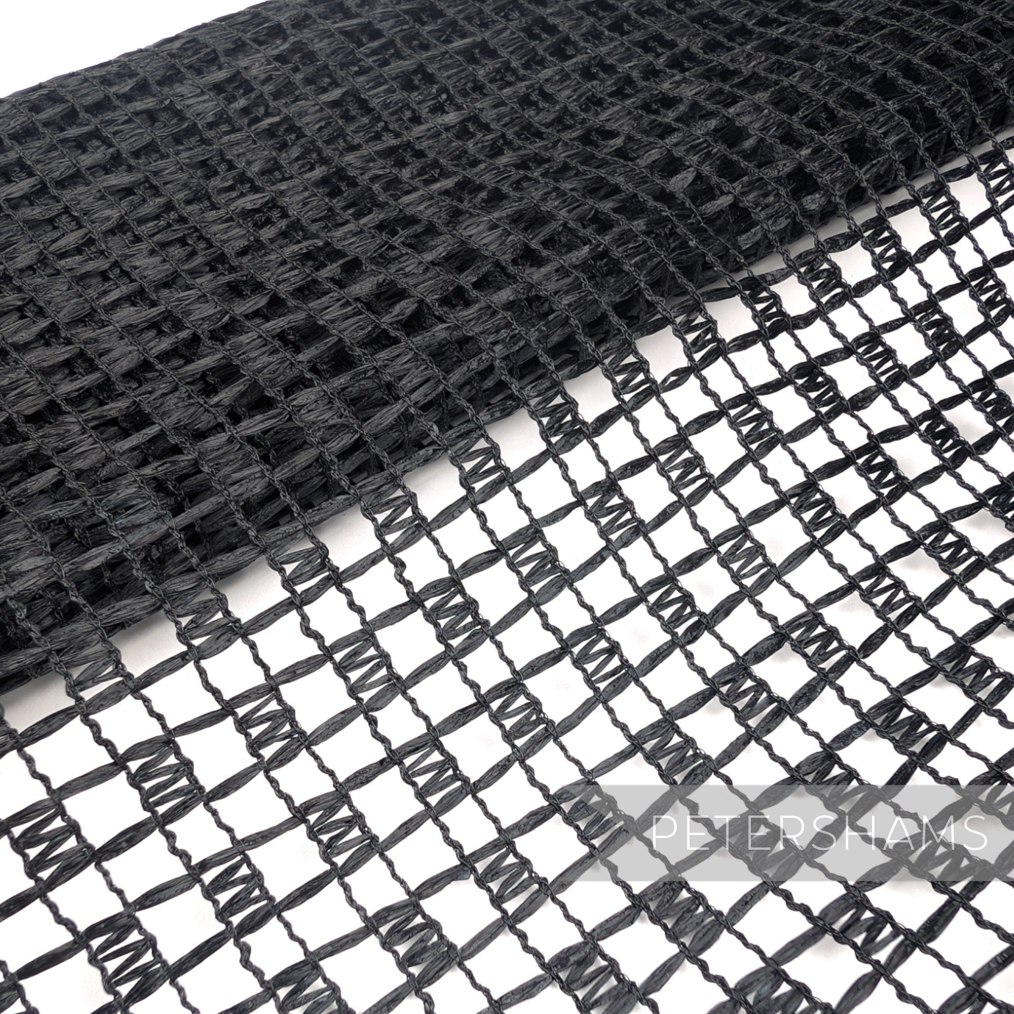 Petershams Millinery Supplies vintage black laminated raffia mesh fabric with a glossy checkerboard weave pattern.