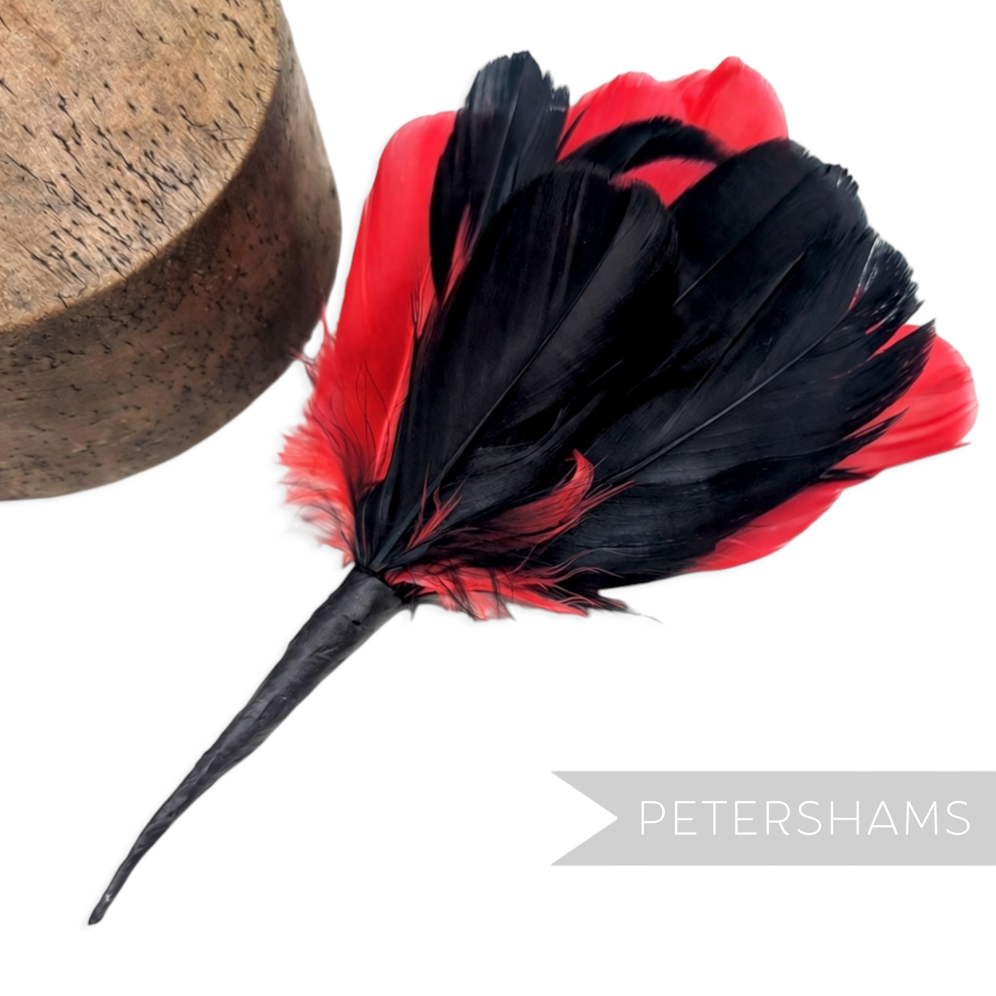 Petershams Millinery Supplies large black and red goose nagorie and french partridge feather hat mount on white