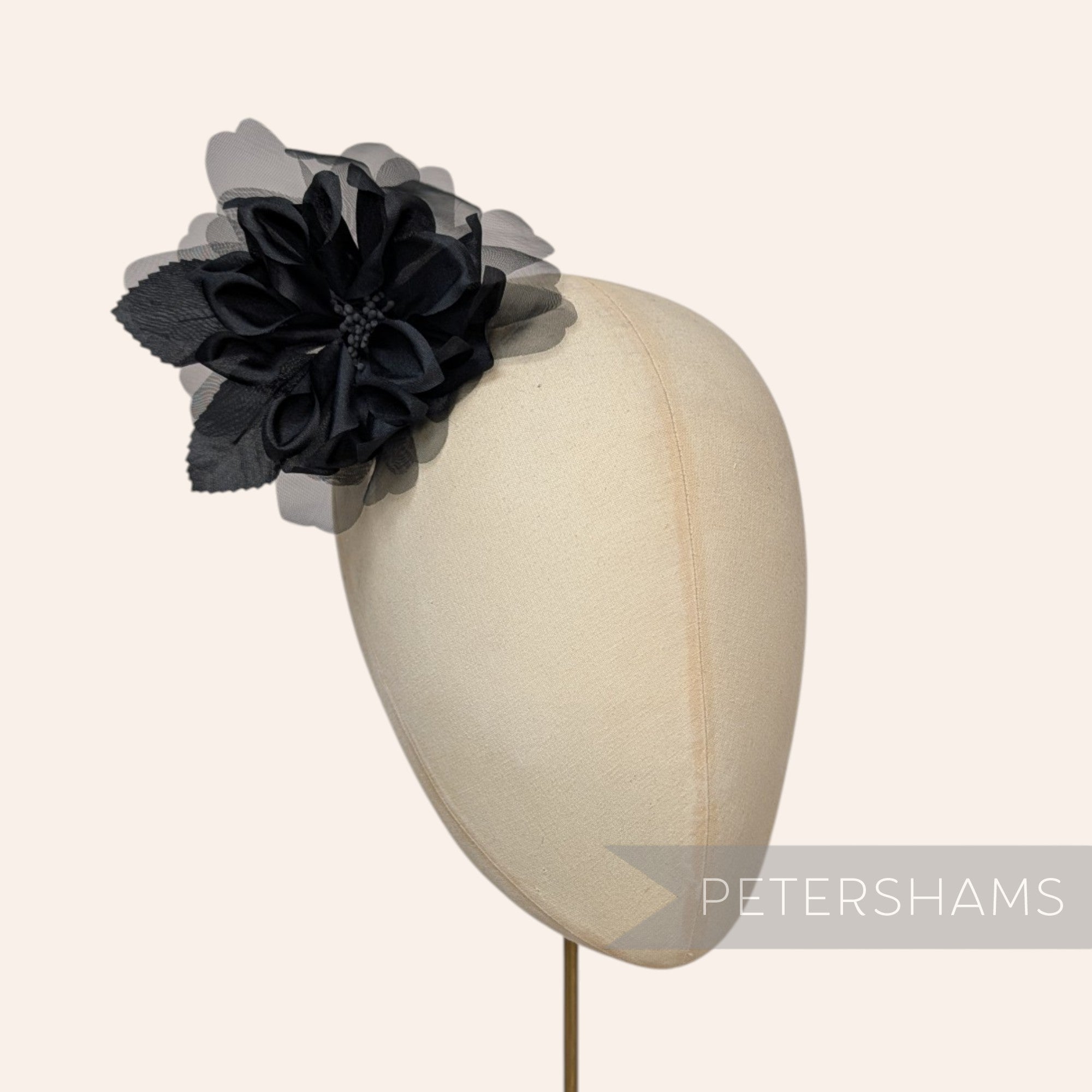 Petershams Millinery Supplies black silk and organza dahlia flower hat mount on a mannequin head