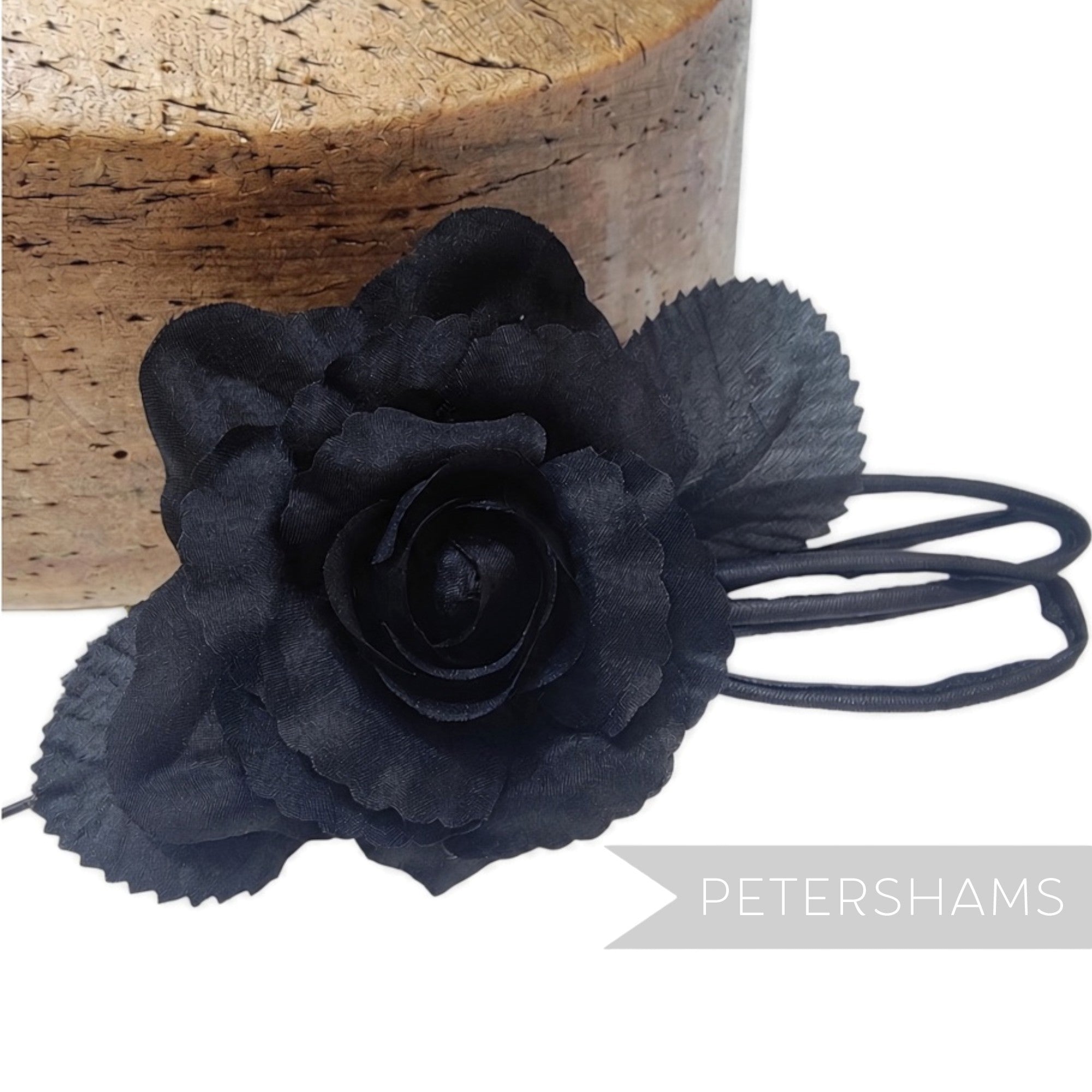 Petershams Millinery Supplies Zahra black silk flower hat mount with wired leaves and loops on a wire stem.