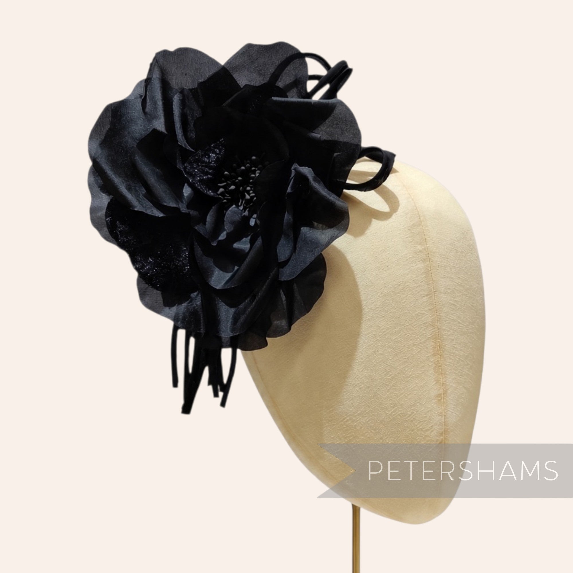 Petershams Millinery Supplies Bria black silk and velvet rose flower with wired stem on a millinery display head
