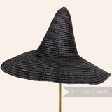 Petershams Millinery Supplies vintage black Swiss straw witches hat capeline form with a high crown and wide brim.
