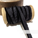 Petershams Millinery Supplies 5mm black velvet insertion piping cord wrapped on a wooden spool for sewing projects.