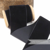 Petershams Millinery Supplies 50mm black French velvet ribbon on a wooden spool for millinery and craft projects.