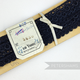 Petershams Millinery Supplies vintage 9mm black Austrian lace trim featuring a teardrop and diamond thatch pattern.