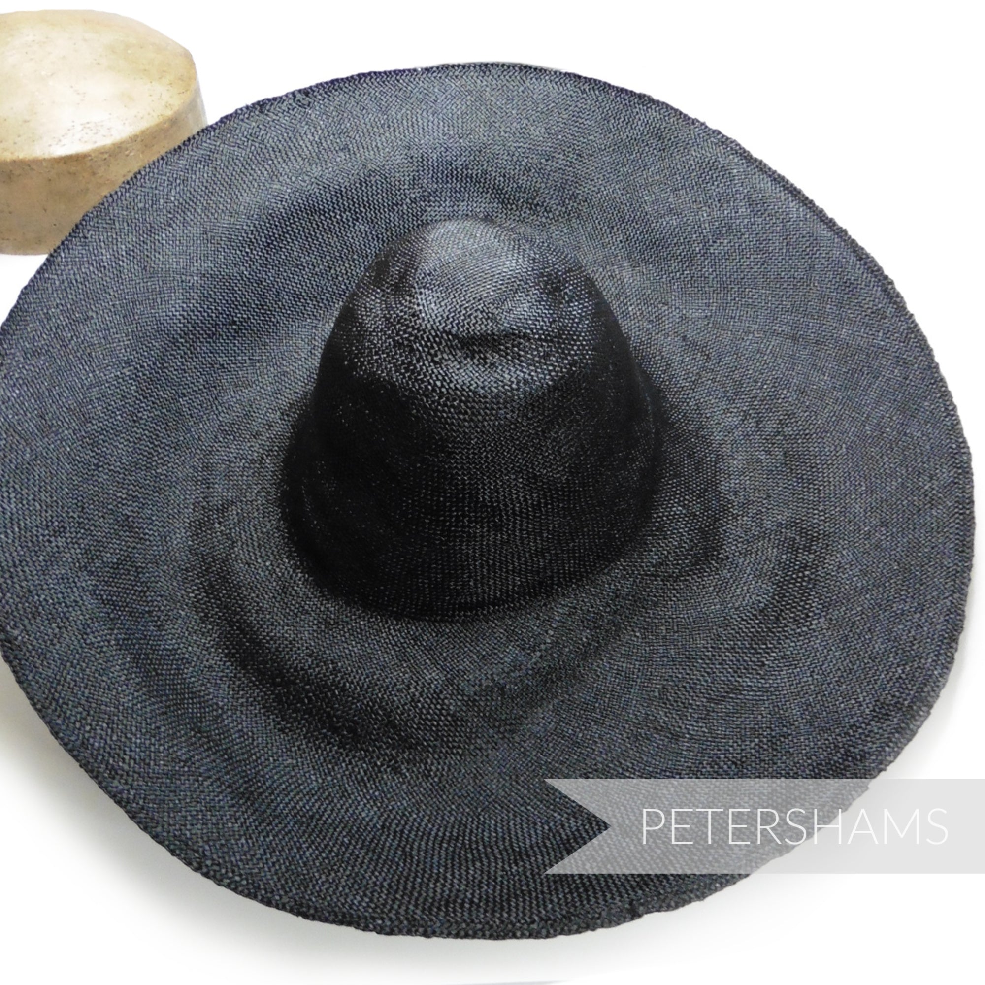 Petershams Millinery Supplies extra large black visca capeline hat body with a 1x1 checkerboard weave.