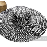 Petershams Millinery Supplies black and white polybraid capeline hat body with a hypnotic undulating brim pattern.