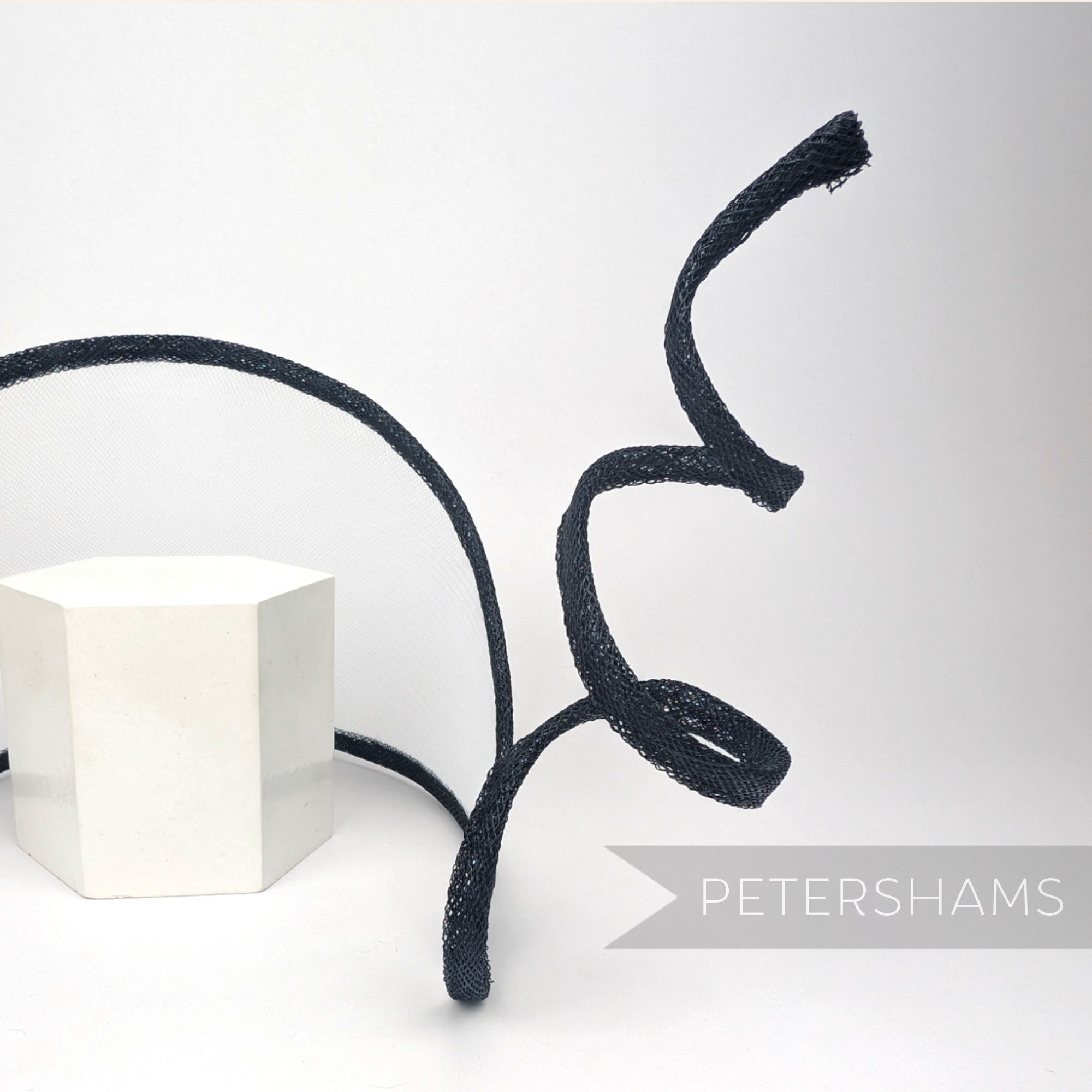 Petershams Millinery Supplies black crin and sinamay wired visor fascinator base with a decorative swirling trim.