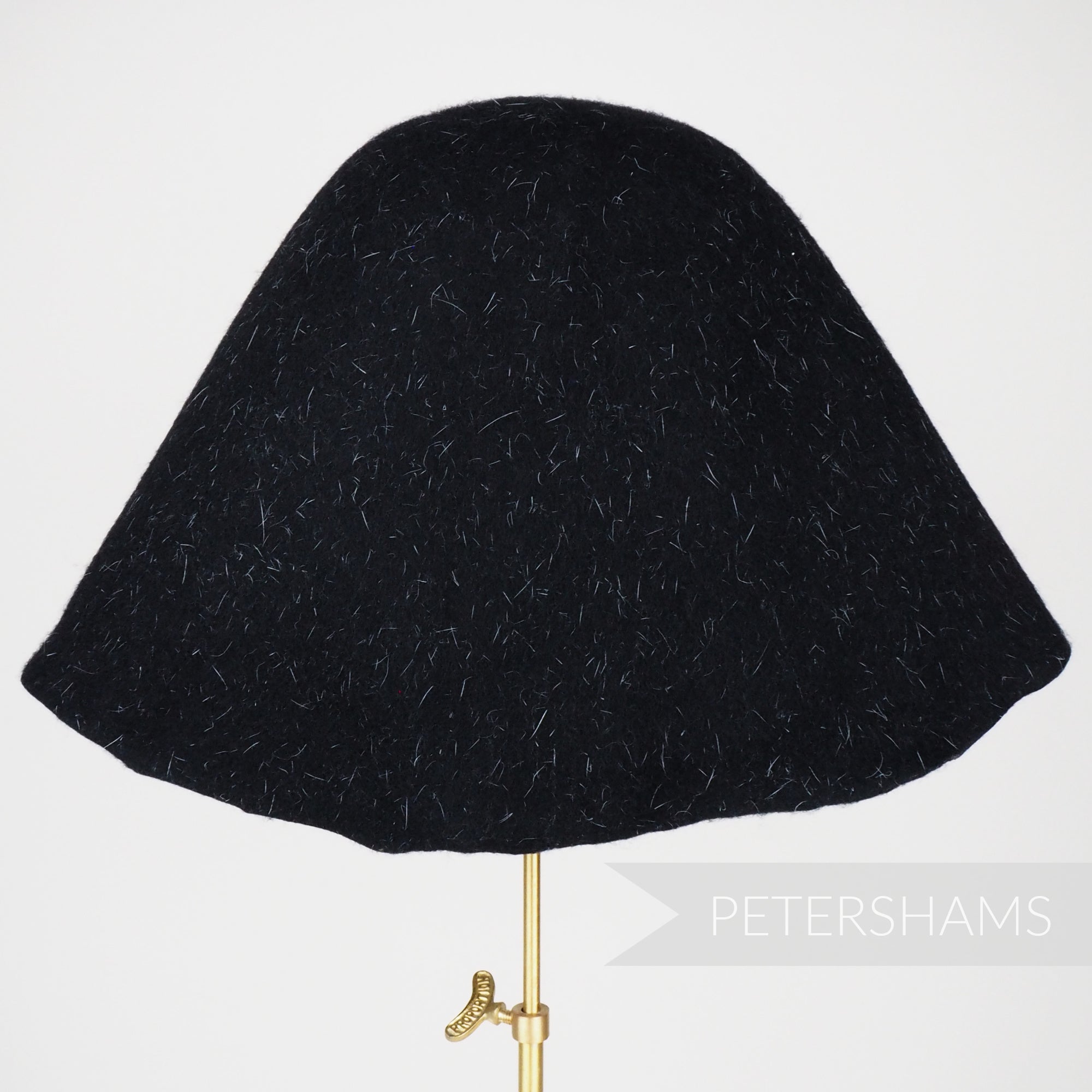 Petershams Millinery Supplies black wool felt cone hat body with ivory hare fur confetti detail for hat making.