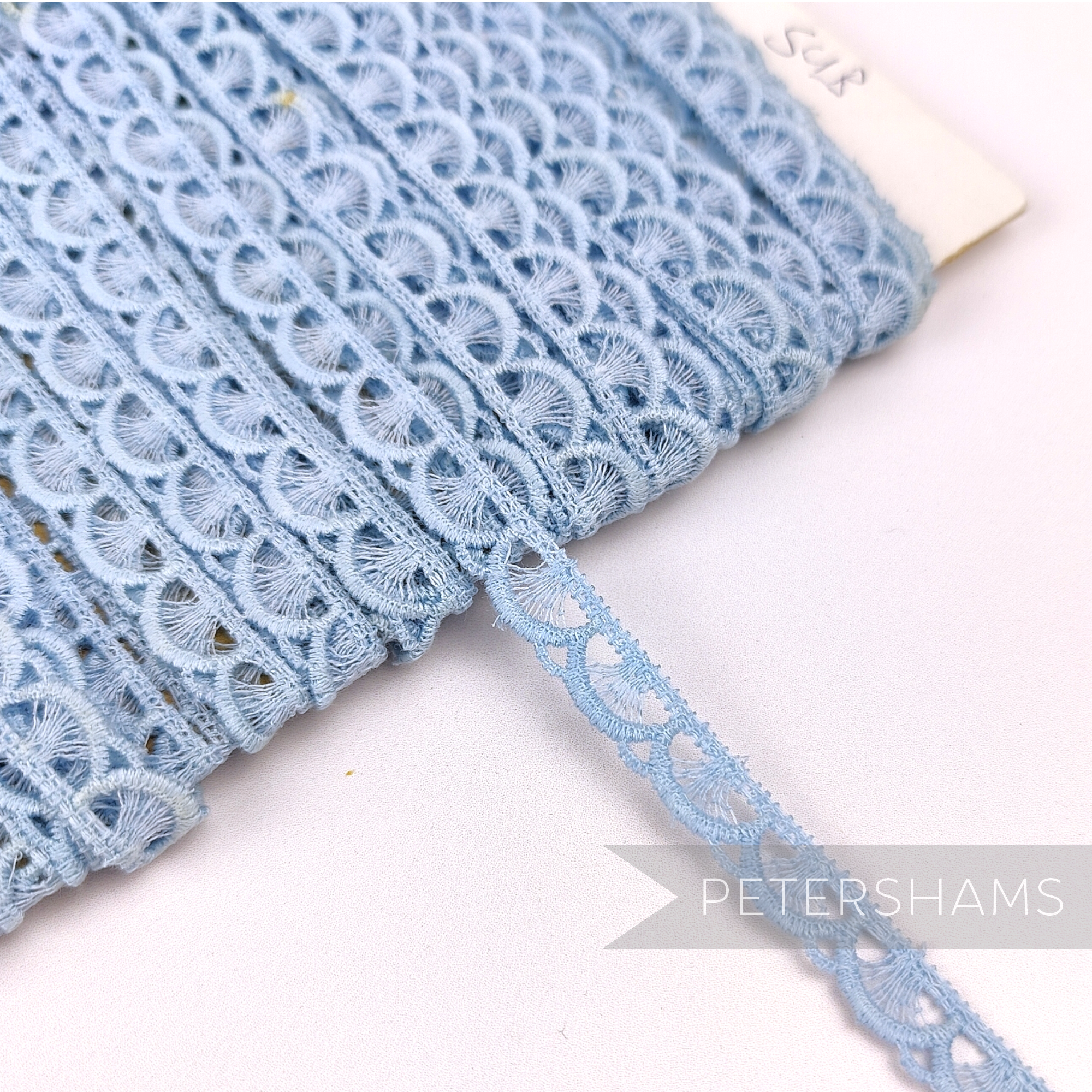 Petershams Millinery Supplies vintage 9mm light blue cotton guipure lace trim with a delicate fan pattern.