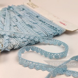 Petershams Millinery Supplies vintage 11mm light blue daisy lace trim on a card with slight dye imperfections