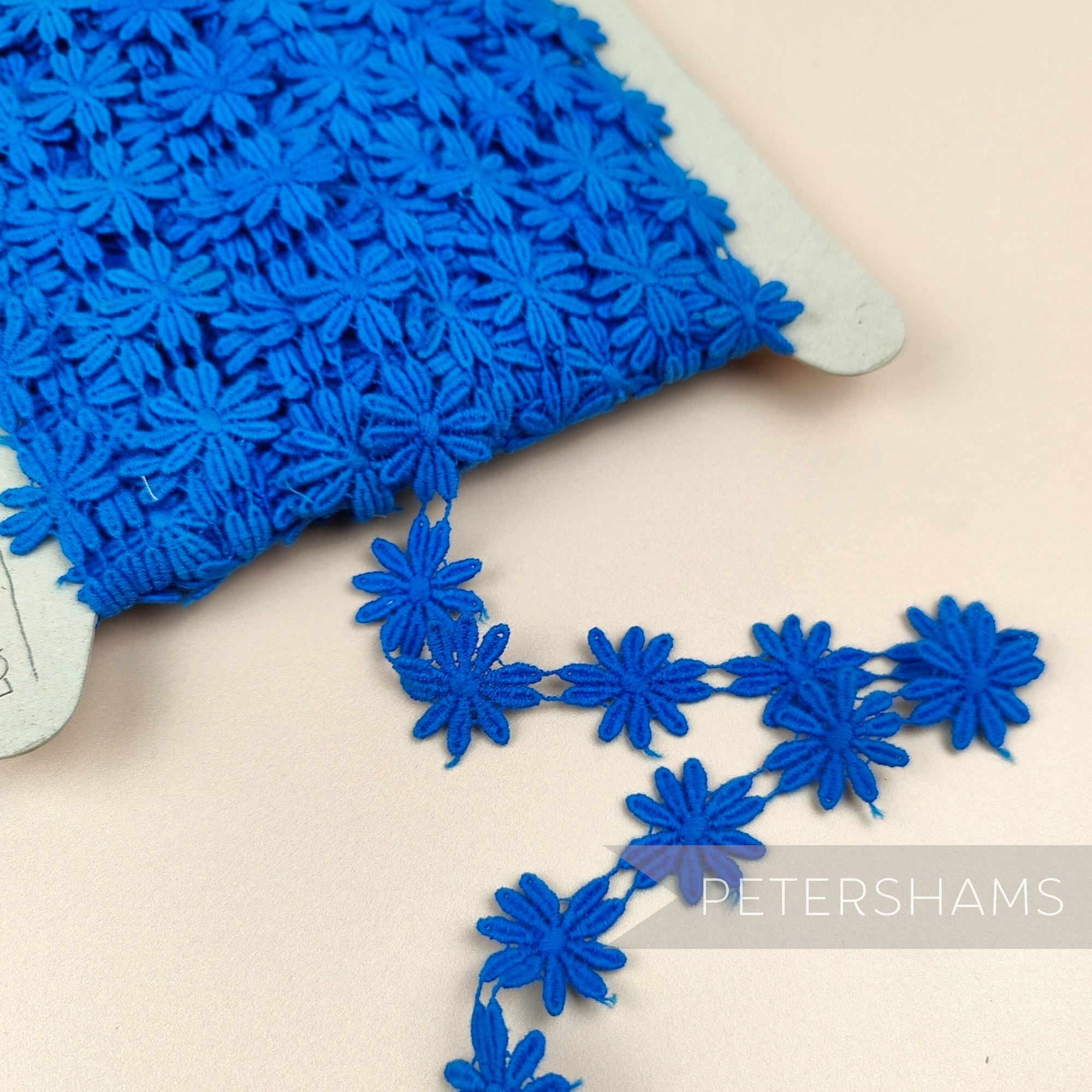 Petershams Millinery Supplies vintage 1990s blue guipure lace daisy flower trim on a spool