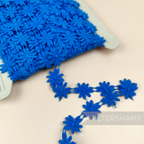Petershams Millinery Supplies vintage 1990s blue guipure lace daisy flower trim on a spool