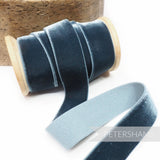 Petershams Millinery Supplies 23mm blue elastic stretch velvet ribbon on a wooden spool for millinery projects