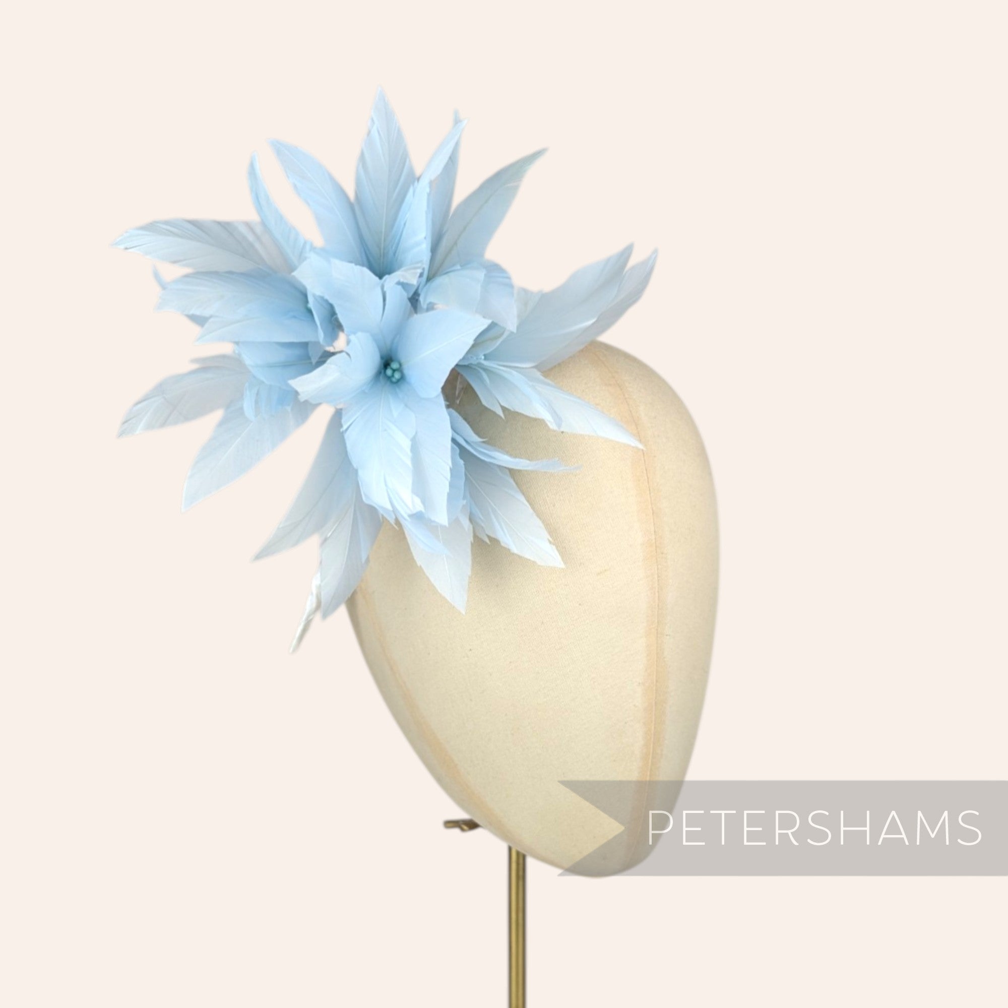 Petershams Millinery Supplies Kay large light blue goose feather pom flower hat mount on a mannequin head